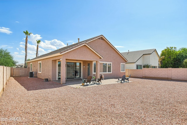 back of property featuring central AC and a patio