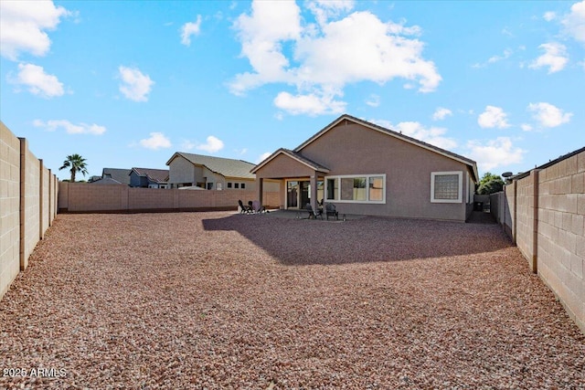 back of house featuring a patio area