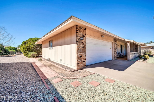 view of side of property with a garage