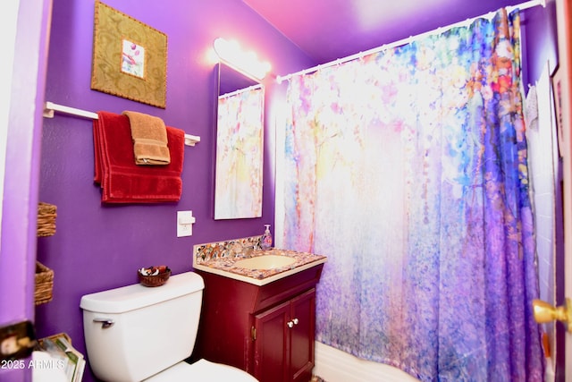 bathroom with vanity, toilet, and a shower with shower curtain