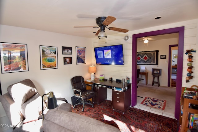 office space featuring ceiling fan and tile patterned floors