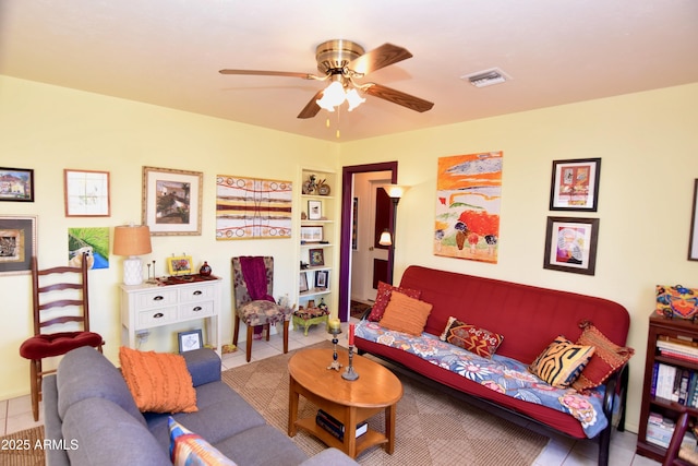 tiled living room featuring ceiling fan