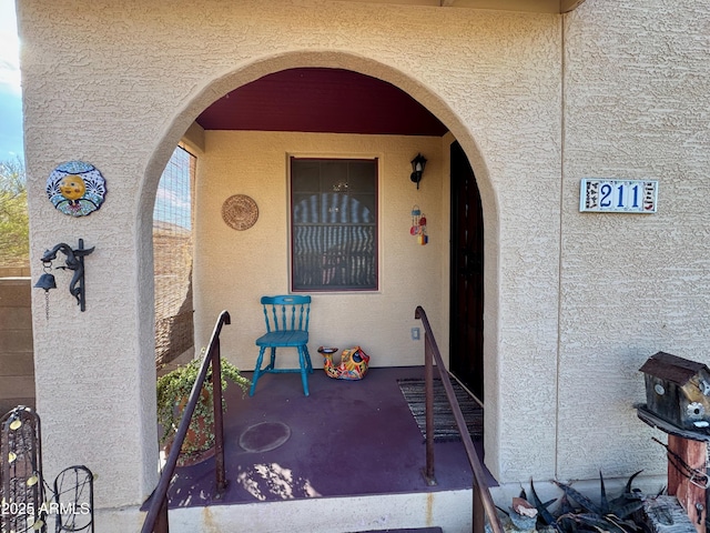 entrance to property with a patio