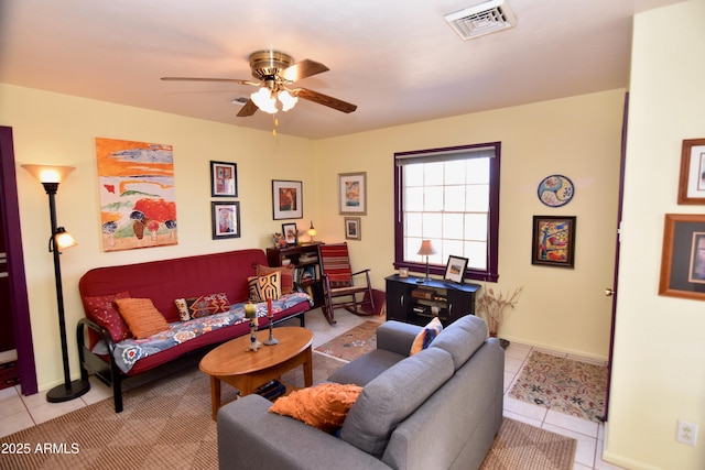 tiled living room featuring ceiling fan