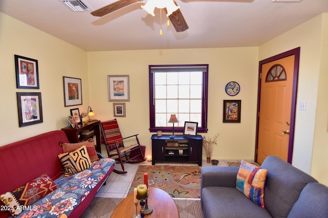 living room featuring ceiling fan and light tile patterned floors