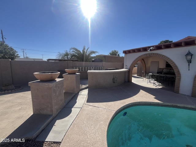 view of pool featuring a patio area