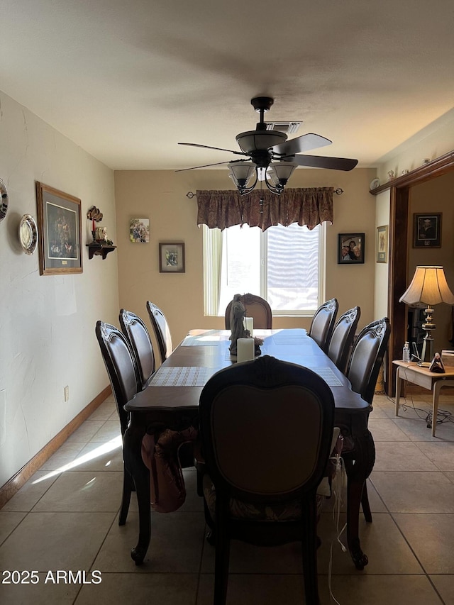 dining room featuring ceiling fan and light tile patterned floors