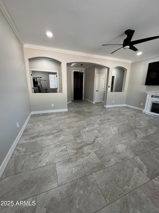 unfurnished living room with crown molding and ceiling fan