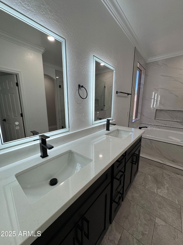 bathroom with ornamental molding and vanity