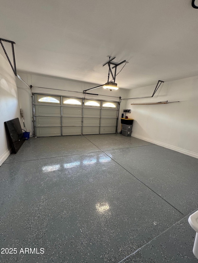 garage featuring a garage door opener