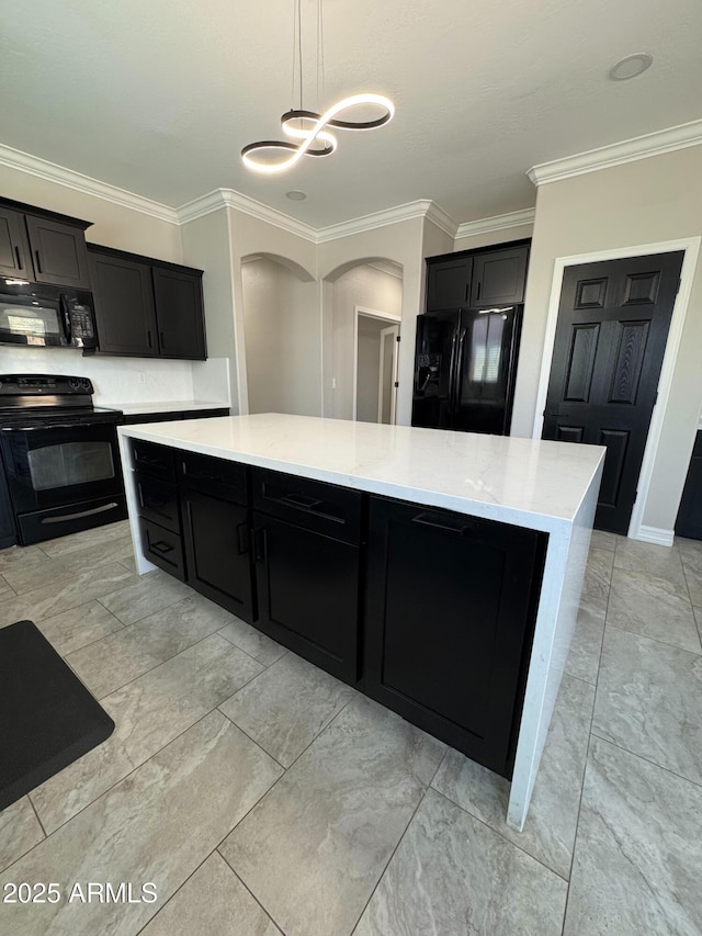 kitchen featuring a kitchen island, crown molding, black appliances, hanging light fixtures, and decorative backsplash