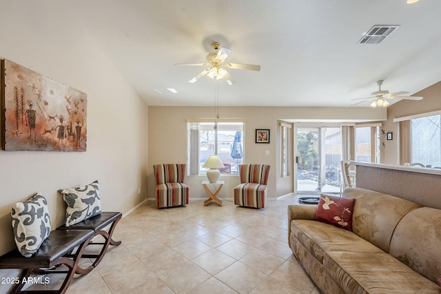 tiled living room featuring ceiling fan