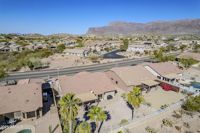 birds eye view of property with a mountain view