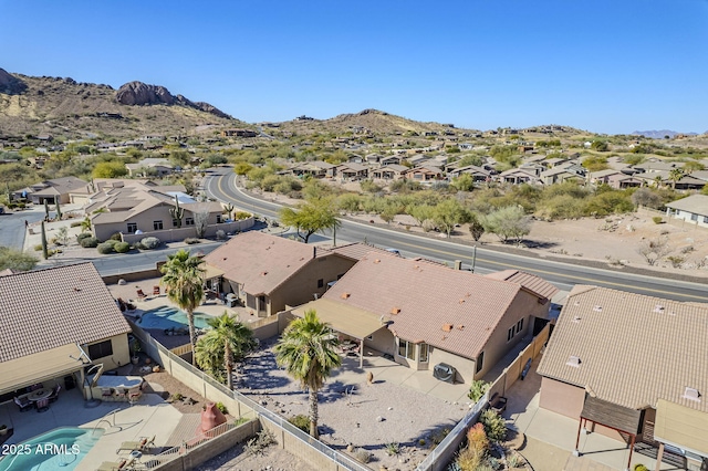 birds eye view of property featuring a mountain view