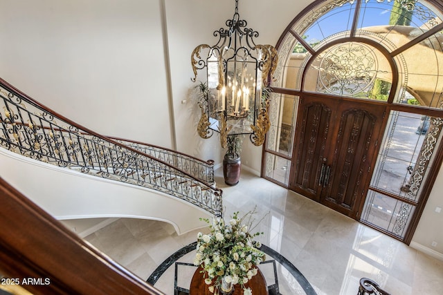 9451 E Happy Valley Rd, Scottsdale, AZ 85255 - foyer with stairs, marble finish floor, an inviting chandelier, baseboards, and a high ceiling