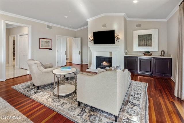 9451 E Happy Valley Rd, Scottsdale, AZ 85255 - living area with baseboards, visible vents, a lit fireplace, and dark wood finished floors