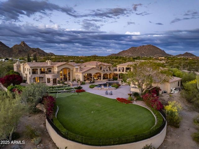9451 E Happy Valley Rd, Scottsdale, AZ 85255 - rear view of property with stucco siding, a mountain view, a chimney, and a patio