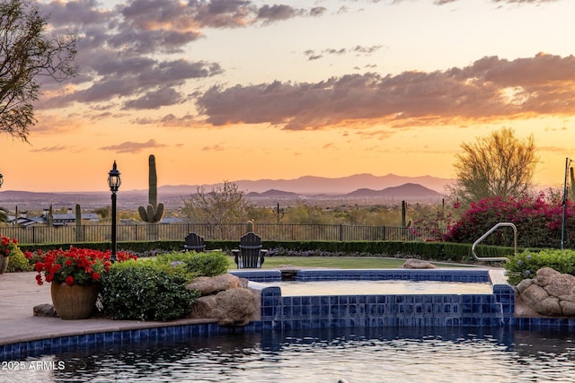 9451 E Happy Valley Rd, Scottsdale, AZ 85255 - view of swimming pool with fence, a hot tub, and a mountain view