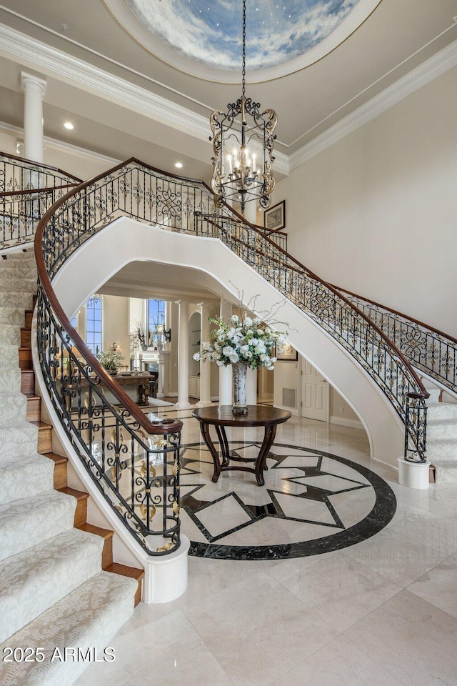 9451 E Happy Valley Rd, Scottsdale, AZ 85255 - entryway featuring stairway, crown molding, a high ceiling, a notable chandelier, and recessed lighting