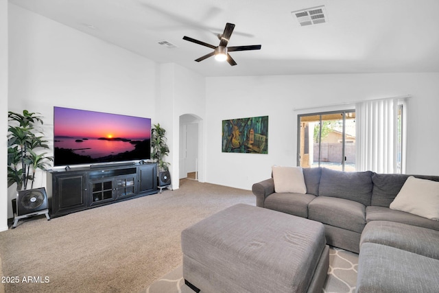 16887 W Belleview St, Goodyear, AZ 85338 - carpeted living area with arched walkways, a ceiling fan, and lofted ceiling