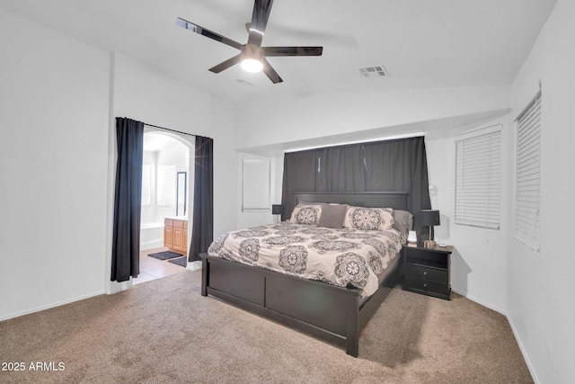 16887 W Belleview St, Goodyear, AZ 85338 - bedroom featuring carpet flooring, lofted ceiling, baseboards, and ensuite bathroom