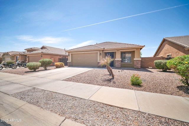 16887 W Belleview St, Goodyear, AZ 85338 - view of front of property with stucco siding, concrete driveway, a garage, and a tiled roof