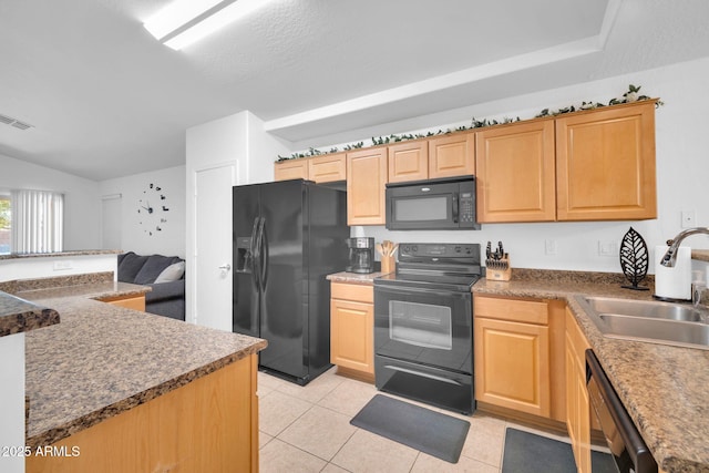 16887 W Belleview St, Goodyear, AZ 85338 - kitchen featuring black appliances, a sink, light tile patterned floors, light brown cabinetry, and vaulted ceiling