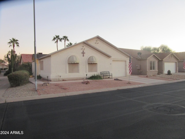 single story home with a garage