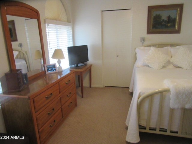 bedroom with light colored carpet