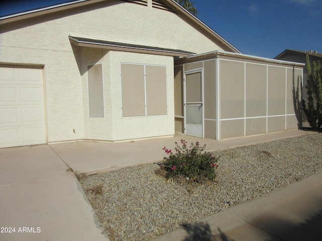 view of side of property with a garage