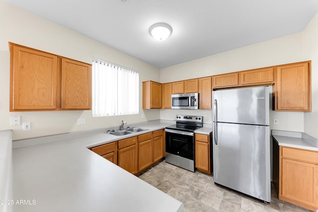 4234 S 62nd Ln, Phoenix, AZ 85043 - kitchen with appliances with stainless steel finishes, light countertops, and a sink