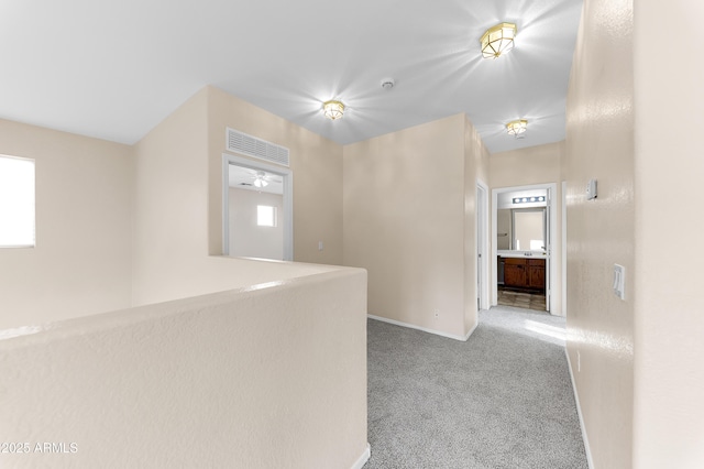 4234 S 62nd Ln, Phoenix, AZ 85043 - corridor featuring baseboards and carpet