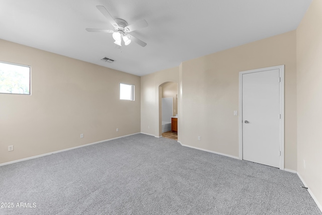 4234 S 62nd Ln, Phoenix, AZ 85043 - interior space featuring baseboards, visible vents, carpet floors, arched walkways, and ceiling fan