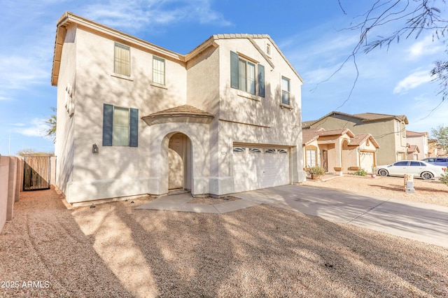 4234 S 62nd Ln, Phoenix, AZ 85043 - mediterranean / spanish-style house with an attached garage, fence, driveway, and stucco siding