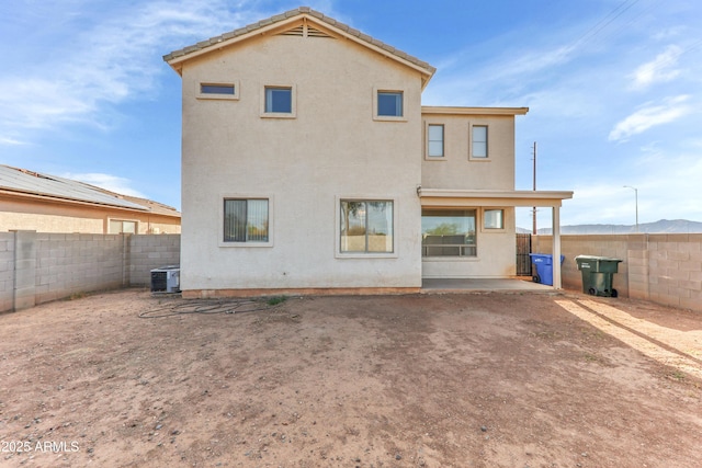 4234 S 62nd Ln, Phoenix, AZ 85043 - rear view of property featuring a patio, central AC unit, a fenced backyard, and stucco siding