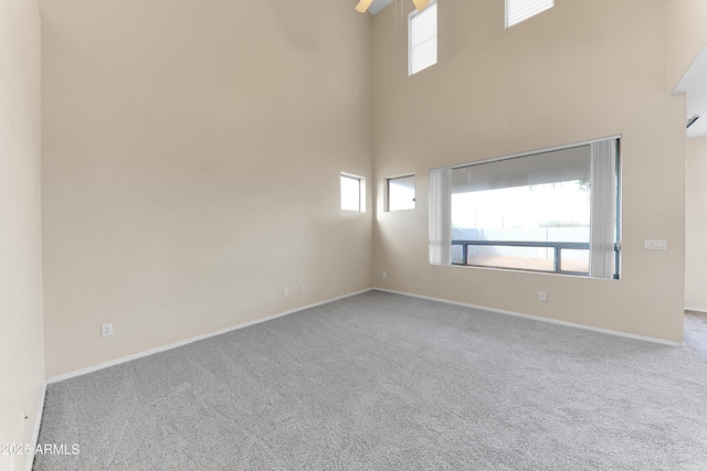 4234 S 62nd Ln, Phoenix, AZ 85043 - unfurnished room with carpet flooring, baseboards, a high ceiling, and ceiling fan