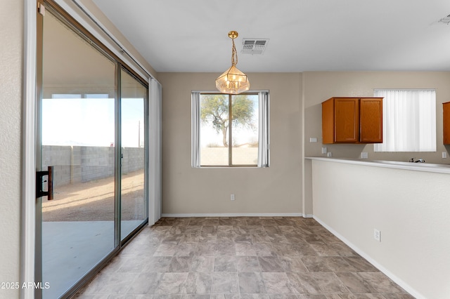 4234 S 62nd Ln, Phoenix, AZ 85043 - unfurnished dining area featuring a notable chandelier, visible vents, and baseboards