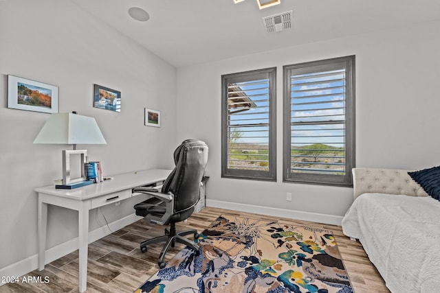 bedroom featuring hardwood / wood-style flooring