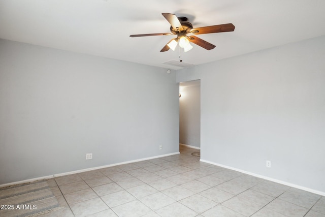 unfurnished room with baseboards and a ceiling fan