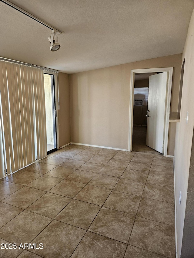 spare room featuring a textured ceiling