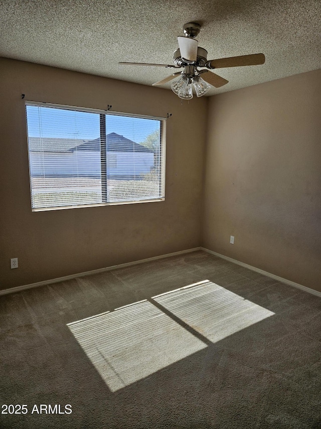 unfurnished room with carpet flooring, ceiling fan, and a textured ceiling