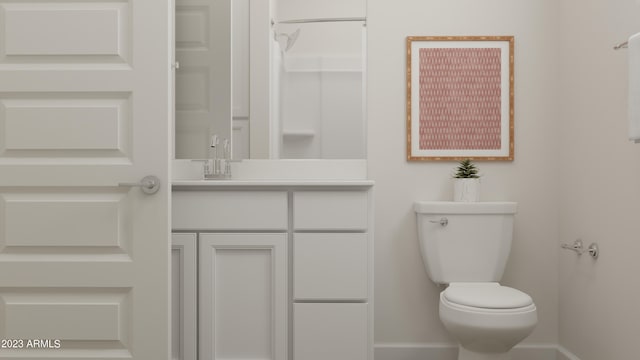 bathroom with toilet and vanity