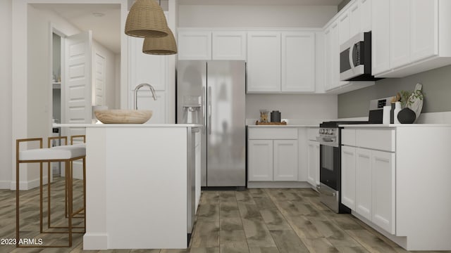 kitchen with appliances with stainless steel finishes and white cabinetry