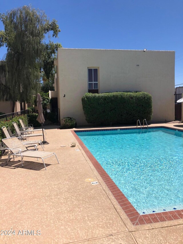 view of pool featuring a patio