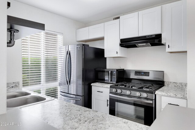 kitchen featuring sink, white cabinets, and appliances with stainless steel finishes