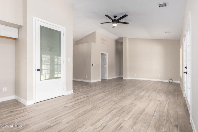 unfurnished living room featuring vaulted ceiling, ceiling fan, and light hardwood / wood-style floors