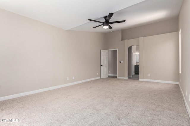 unfurnished bedroom featuring ceiling fan, lofted ceiling, and carpet