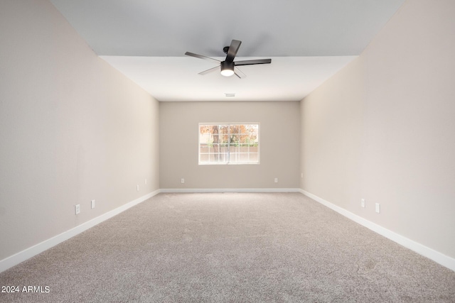 unfurnished room with ceiling fan and carpet floors