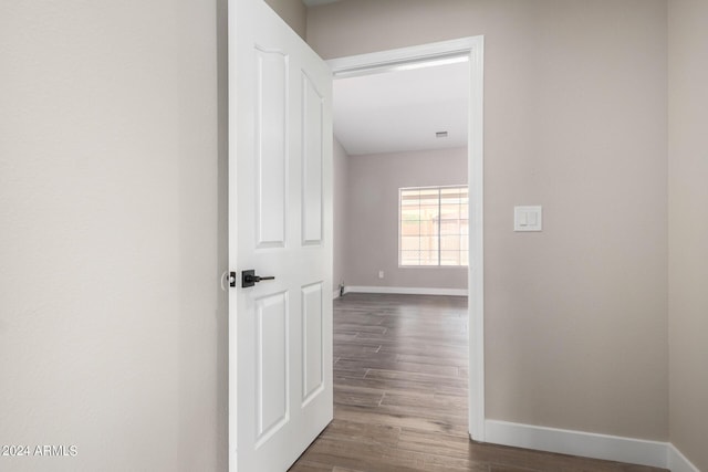 hallway featuring dark wood-type flooring