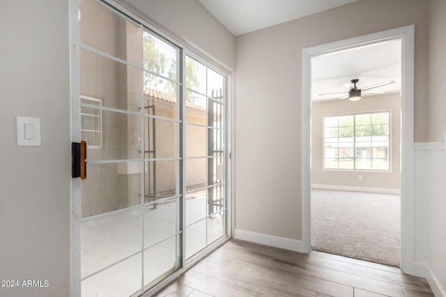 entryway featuring ceiling fan and light wood-type flooring